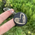 Wooden MAMA keychain detail showing engraved heart pattern and metal clasp for everyday carry style. - Style 5