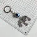 Vintage evil eye elephant metal keychain with blue rhinestones for stylish daily use. - Elephant