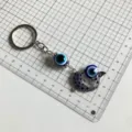 Turkish evil eye keychain with blue rhinestone fish pendant metal keyring size display - Evil Eye Little Fish