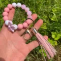 Pink silicone bead wristlet keychain with cute bow and PU tassel detail for daily use. - Pink and White Combination