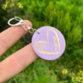 Detailed close-up view of the purple wooden keychain featuring engraved heart and mama text. - Style 3