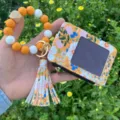 Floral card holder wristlet keychain, colorful silicone bead bracelet with tassel detail. - Cayenne Orange