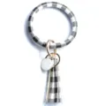 Bracciale portachiavi rotondo in pelle a quadri bianco e nero con nappina e chiusura in metallo. - Quadretti Bianchi