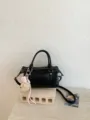 Chic black pillow shoulder bag with cute plush charm, versatile stylish women handbag. - With Pendant / Black