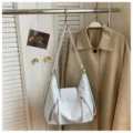 White PU leather hobo shoulder bag with zipper pockets and flap closure for daily wear. - Blue Without Charm