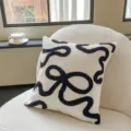 Housse de coussin touffetée moderne et abstraite, coussin décoratif noir et blanc pour canapé. - Ruban de nœud