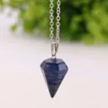 Close-up of a blue lapis lazuli hexagonal prism pendulum pendant necklace detail. - Lapis Lazuli