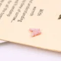 Pink shell butterfly pendant necklace detail, delicate invisible fishing line design. - Pink Carved Butterfly