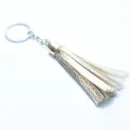 Golden leather tassel keychain with silver ring bag charm accessory pendant for women - Rose Gold