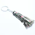 Leather tassel keychain detail view, floral print bag charm pendant for women, stylish accessories. - Bull Head Rose