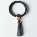 Élégant bracelet porte-clés cercle pompon en cuir PU avec anneau métallique doré - Bleu marine