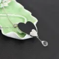 Elegant long sweater chain with black heart pendant and sparkling rhinestone details. - Double Heart Style