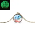 Detailed view of the luminous galaxy glass ball pendant necklace with bronze chain. - Galaxy 1