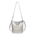 Silver metallic bucket bag with handmade beaded handle, stylish shoulder and crossbody design. - Silver