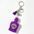 Lila Strass Totenkopf Parfümflasche Schlüsselanhänger mit Quaste für stylische Taschen - Lila