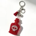 Roter Strass Totenkopf Parfümfläschchen Schlüsselanhänger mit Quaste und Anhänger. - Rot