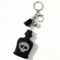 Strass Totenkopf Parfümflasche Schlüsselanhänger mit schwarzem Quasten Taschen Anhänger. - Schwarz
