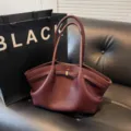 Burgundy pebbled leather tote bag with dual handles, large capacity and stylish side folds. - Z Ankara Red