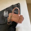 Pink PU leather shoulder bag for women, stylish casual handbag with metal buckle and charms. - With Pendant / Pink