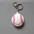 Baseball keychain leather sports pendant detail view showing realistic red stitching and metal ring. - Baseball