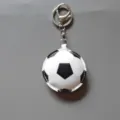 Leather football keychain, detailed view of the sports ball pendant with metal ring. - Football