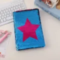 Reversible sequin notebook detail view showing blue and pink star pattern on soft cover surface - Pentagram