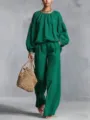 Grünes zweiteiliges Freizeitoutfit mit Laternenärmel-Top und weiter Hose Detail. - Grün