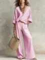 Pink loose casual V-neck blouse and wide-leg trousers set, stylish resort wear detail. - Peach