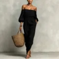 Elegante vestido largo negro con hombros descubiertos, cintura elástica y diseño. - S / Negro