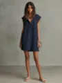 Close-up details of the sleeveless hooded mini dress featuring a V-neck and raw frayed edge design. - Navy Blue