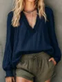 Detail shot of a stylish dark blue long sleeve V-neck lantern sleeve women blouse top. - Navy Blue