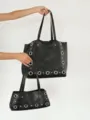 Detail view of black PU leather tote bag featuring metal grommets and rivets, chic shoulder bag. - Black (Small)