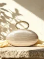 French light luxury oval clutch bag with PU texture and sculpted metal handle for evening. - Apricot