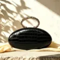 French luxury oval clutch bag black crocodile texture metal ring handle evening bag - Black