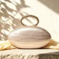 Elegant French style oval clutch bag with PU crocodile texture and chic metal ring handle. - Nude