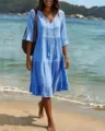 Light blue V-neck tiered midi dress with tassels for beach vacation and casual summer wear. - Sky Blue