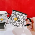 Close-up detail of cute ceramic coffee mug with smiley faces pattern and stylish black rim. - 350ml / Smiley Face