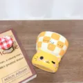Detailed close-up of a cute yellow cat ceramic mug featuring playful checkered patterns and text. - 300ml / Orange Kitten