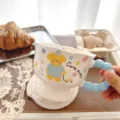 Close-up detail of cute ceramic cartoon puppy coffee mug with creative blue bubble handle. - 400ml / Polka Dot Puppy Car