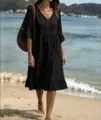 Black tiered beach dress with v-neck tassel details, casual summer vacation wear midi style. - S / Dresses / Black