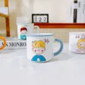 Detailed shot of cute couple ceramic mugs featuring cartoon character designs on a clean tabletop. - 320ml / Blue Boy