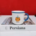 Detailed closeup view of ceramic coffee mug featuring cute cartoon tiger pattern and blue handle. - Dark Blue Birthday Hat