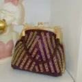 Sparkly purple rhinestone evening clutch bag with gold frame, elegant and compact design for party. - Deep purple