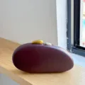 Burgundy acrylic pebble clutch bag, matte finish oval evening handbag with metal clasps. - Burgundy