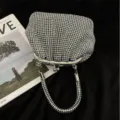 Glänzende Strass-Abendtasche im Muscheldesign mit Metallrahmen und edlem Kristallgriff für Party. - Silber