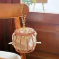Rhinestone birdcage bucket bag with gold chain handle and white velvet inner pouch. - Pink