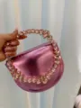 Pink metallic evening handbag featuring a sparkling crystal-encrusted circular handle. - Leather Pink