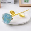 Epoxy resin blue rose flower handicraft with gold stem displayed on white ceramic plate SKU item - Aquamarine - Gold Base