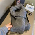 Grey knitted scarf winter warm neck wrap soft cozy textured fashion accessory detail view - Solid Dark Gray
