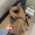 Detailed view of cozy brown knit scarf, soft winter warm neckwear in elegant setting. - Heather Coffee